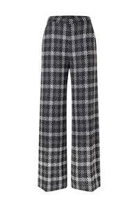 Brede broek in een zwart-grijze ruitpatroon, gemaakt van gestructureerde stof, met een hoge taille en een lange, vloeiende silhoët.