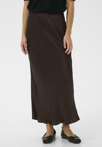 Brown maxi skirt made of lightweight fabric, featuring a flowing shape with a smooth texture and a slight flare at the hem.