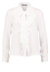 Blusa bianca con maniche lunghe, dettagli arricciati sul davanti, tessuto morbido e colletto legato. Presenta polsini con bottoni e una consistenza liscia.
