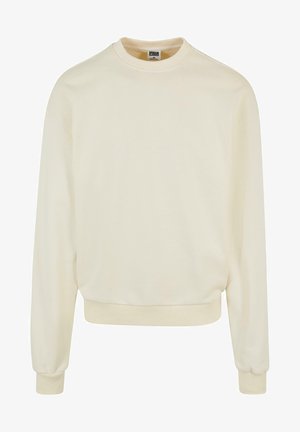 Krémszínű pulóver, puha anyagból készült, kerek nyakkivágással, hosszú ujjal, bordázott mandzsettagal és aljjal. Nincsenek minták vagy grafikák.