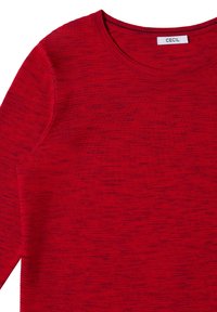 Top lungo a maniche lunghe di maglia rossa con scollatura rotonda e leggere variazioni di texture. Etichetta con la scritta "CECIL." Realizzato in un tessuto morbido e leggero.