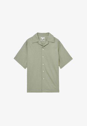 Short-sleeve, collared shirt in light green fabric with a smooth texture, featuring four white buttons and a straight hem.