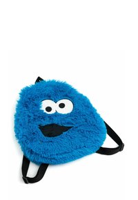 Zaino in peluche blu a forma di volto di cartone animato, con grandi occhi bianchi e una bocca nera. Include spallacci neri regolabili.
