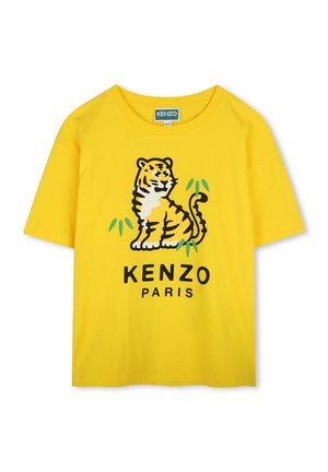 Yellow cotton T-shirt featuring a black and orange tiger graphic with green accents and "KENZO PARIS" printed below. Short sleeves, relaxed fit.