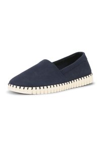 Chaussure slip-on bleu marine avec tige en tissu doux et semelle en caoutchouc blanche texturée avec des détails cousus le long du bord.