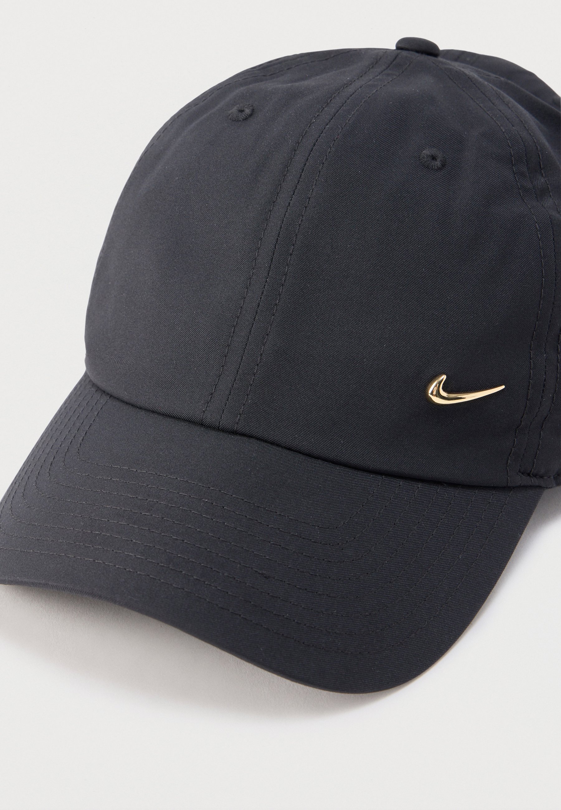 black nike hat with gold swoosh