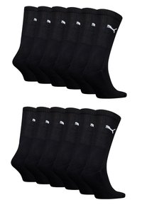 Packung mit 12 schwarzen Baumwollsocken mit gerippten Bündchen und weißen Logo-Details. Standard Crew-Länge, mit glatter Textur und dehnbarem Sitz.