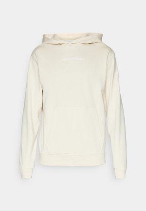 Crème-kleurige hoodie van zachte stof, met een voorkant pocket, ribgebreide mouwen en "HELly HANSEN" geborduurd in het wit op de borst.