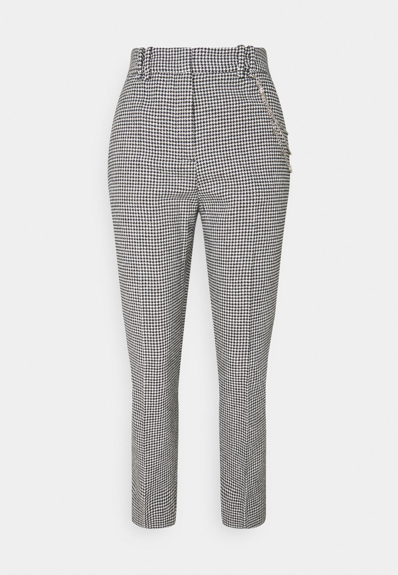 Broek met pied-de-poulepatroon in zwart en wit, met een strakke pasvorm, taps toelopende pijpen en zijzakken met metalen accenten.