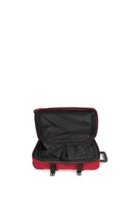 Valigia con ruote rosse e interno nero, dotata di più scomparti e maniglie. Materiale resistente con cerniere e cinghie di sicurezza.