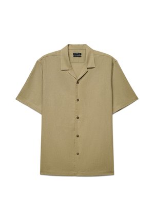 Chemise beige à manches courtes avec col campagnard, cinq boutons visibles et coupe décontractée.