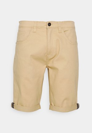 Pantaloni corti khaki fino al ginocchio in cotone, con una texture liscia, risvolti, due tasche frontali e chiusura con bottone nero.