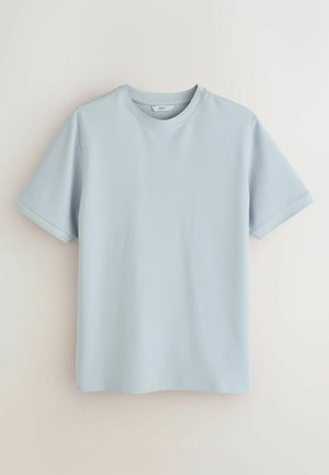 Svetlomodré textúrované bavlnené tričko s krátkym rukávom a okrúhlym výstrihom, zobrazené na jednoduchom neutrálnom pozadí.