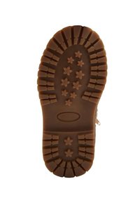 Talpă de cauciuc maro cu un model texturat ce prezintă un tread în formă de stea și striații pentru aderență. Logo circular în centru.