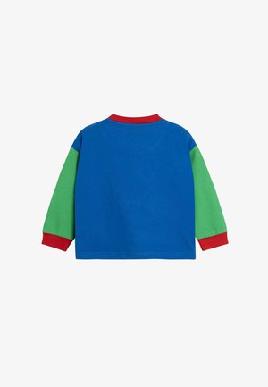 Pikend varrukatega särk, millel on sinine keha, rohelised varrukad ja punane krae. Valmistatud pehmest puuvillast.