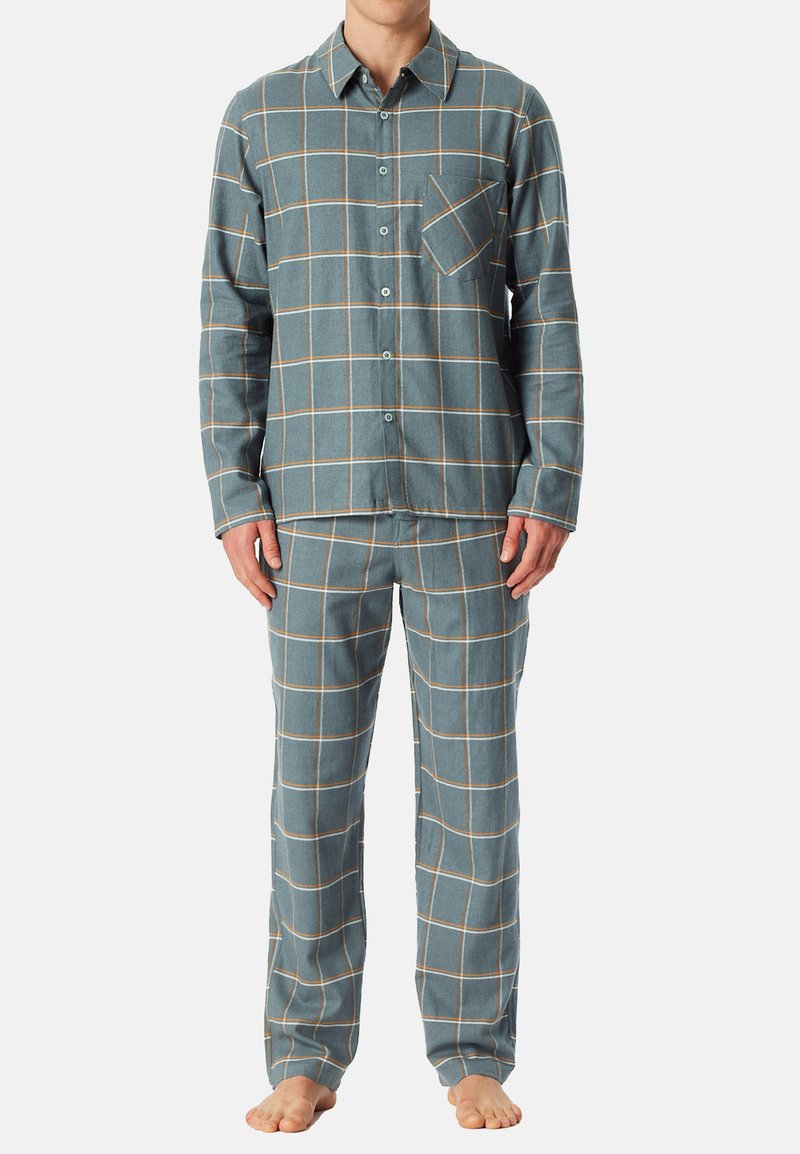 Ruokalaita pyjama-asusto sinisessä ja vaaleanruskeassa. Pitkähihainen napitettava paita, jossa rintatasku. Vastaavat housut joustavalla vyötäröllä. Pehmeä kangas.