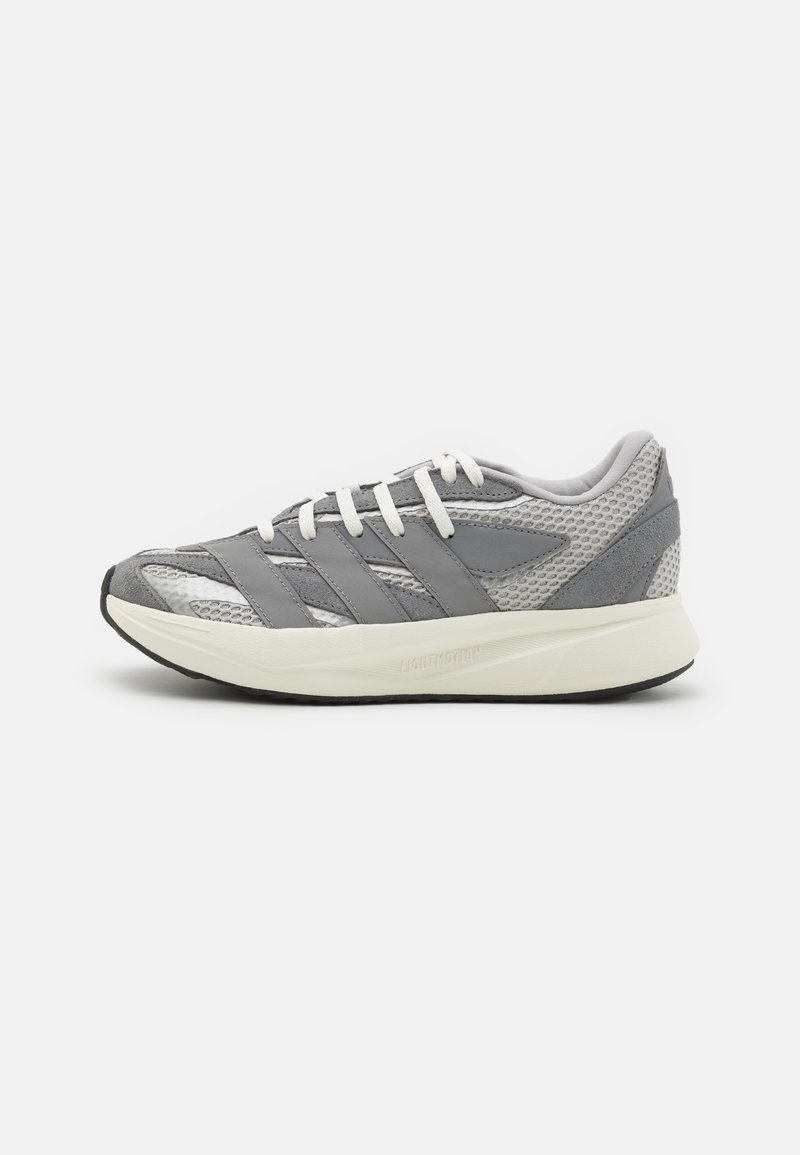 Lightweight athletic shoe with a gray mesh and suede upper, white laces, and a cream outsole. Features three gray stripes on the side.