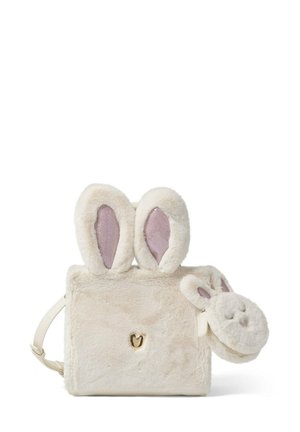Sac en fausse fourrure crème avec des oreilles de lapin en peluche et une pochette zippée en forme de visage de lapin. Équipé de quincaillerie dorée en forme de cœur et d'une sangle réglable.