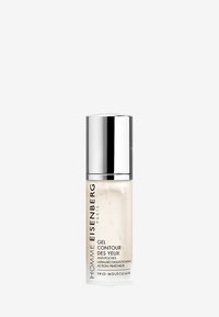 Contour des yeux en gel transparent dans un flacon transparent avec un capuchon argenté. Le texte sur l'étiquette comprend des détails sur la marque et le produit en noir.