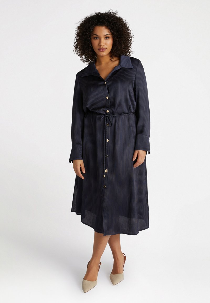 Navy blue button-down dress with pinstripes, long sleeves, and a drawstring waist. Features gold-tone buttons and a flowy A-line silhouette.