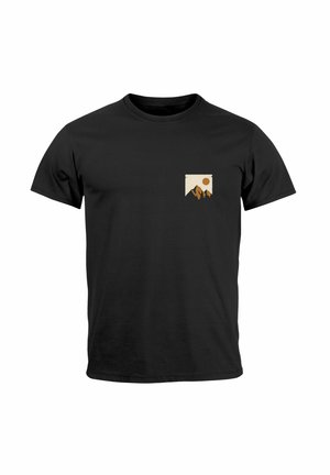 Black cotton t-shirt featuring a small beige patch design with mountains and sun illustration on the left chest area. Classic crew neck style.