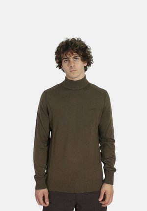 Maglione a collo alto in maglia marrone con polsi e orlo a costine, caratterizzato da un sottile dettaglio del logo sul petto e un design aderente.