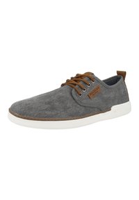 Gray canvas sneaker with brown leather accents, round toe, white rubber sole, lace-up design, and textured surface.