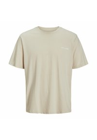 Beige színű pamut póló rövid ujjal, kerek nyakkivágással és kis fehér logóval a mellrészen. Puha tapintású és normál szabású dizájn.
