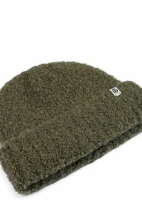 Dark green textured knit beanie with a small white brand tag near the edge, set against a white background.