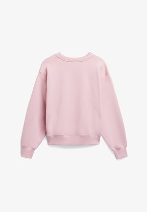 Ljusrosa sweatshirt med en mjuk textur, lös passform, sänkta axlar samt ribbade muddar och nederkant. Baksidan har en ren, sömlös design.
