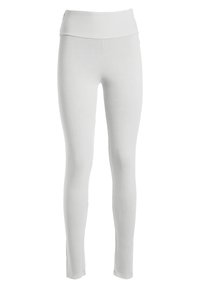 Leggings blancas con una cinturilla alta. Hechos de una tela suave y elástica, cuentan con un diseño ajustado y sin costuras o patrones visibles.