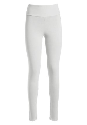 White leggings with a high waistband. Made from a smooth, stretchy fabric, they feature a fitted design and no visible seams or patterns.