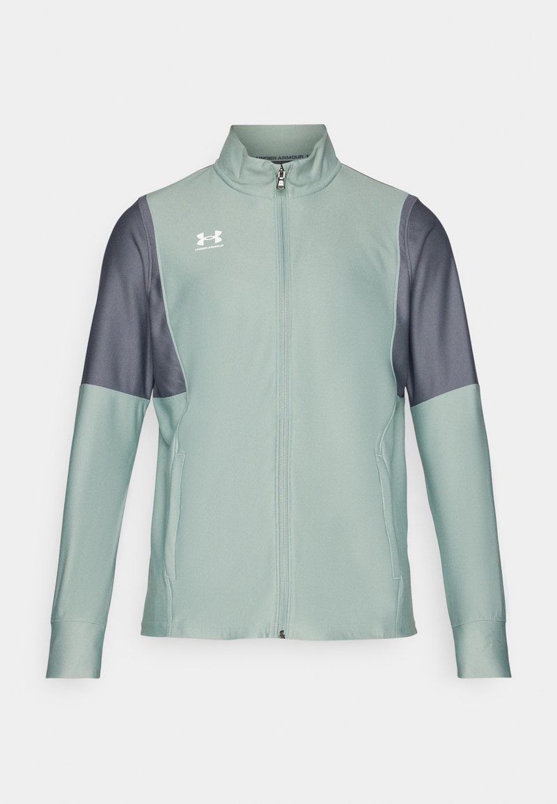 Giacca zip-up verde chiaro con maniche grigio scuro, texture liscia e tasche laterali. Presenta il logo Under Armour sul petto.