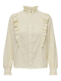 Lichtgele blouse met ruches bij de kraag en zijpaneel. Heeft een geborduurd bloemenpatroon en een knoopsluiting, lange mouwen met gerimpelde manchetten.