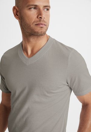 Gray v-neck t-shirt with short sleeves, made from a smooth cotton blend fabric, featuring a subtle sheen and fitted silhouette.