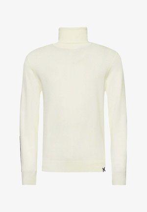 Maglione a collo alto color crema con maniche lunghe, polsini e orlo a coste, caratterizzato da un design minimalista e un piccolo logo vicino al fondo.