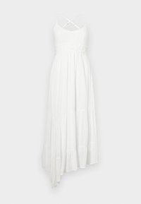 White maxi dress with a textured knit bodice, pleated skirt, and an asymmetrical hem. Features crisscross spaghetti straps and a crochet waistband.