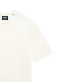 Cremefarvet T-shirt med rund halsudskæring og korte ærmer. Har et diskret præg af en ørnelogo på brystet. Blødt bomuldsstof.