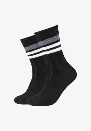 Chaussettes noires avec texture côtelée, présentant trois rayures horizontales en gris et blanc en haut. Longueur intermédiaire avec des talons renforcés.
