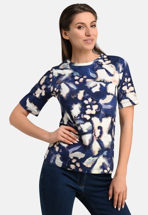 Floral short-sleeve T-shirt in navy blue, featuring cream and light pink patterns, round neckline, and smooth texture.