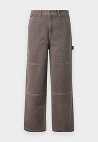 Weite Hosen in einem verblassten Braunton, aus strapazierfähigem Stoff mit kontrastierenden Nähten. Mit Paneeldetails und einer Seitentasche.