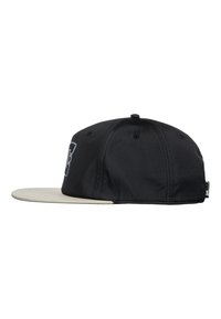 Schwarze Baseballkappe mit einem flachen, beigen Schirm. Verfügt über ein auffälliges grafisches Logo auf der Vorderseite. Hergestellt aus einem Stoff mit glatter Textur.
