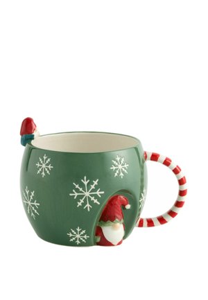 Green ceramic mug with white snowflakes, red-and-white striped handle, and gnome figures on rim and base of cup.