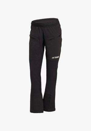 Pantaloni neri da esterno con vita elastica, due tasche con zip e sezioni rinforzate sulle ginocchia. Realizzati in un tessuto resistente e flessibile.