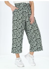 Pantaloni culotte con stampa floreale e cintura elastica. Presentano grandi fiori verde menta su uno sfondo nero e tasche laterali.