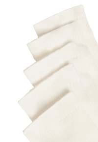 White ribbed cotton socks stacked, featuring a smooth texture with a seamless toe design. Five pairs shown, highlighting uniform color and pattern.