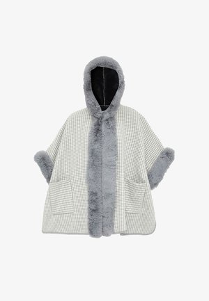 Houndstooth-mønstret poncho i grå og hvid med en faux fur hætte og kant, udstyret med to forlommer og bredde ærmer.
