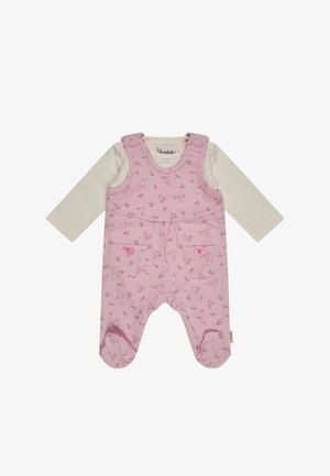 Pink footed baby romper with small bunny and flower print, cream long-sleeve shirt underneath, and front patch pockets with bows.