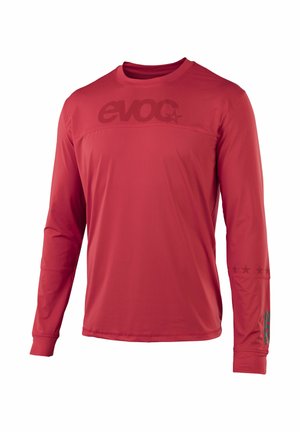 Red long-sleeve athletic shirt with crew neck, "evoc" logo across chest and left sleeve, and small star designs on right forearm.