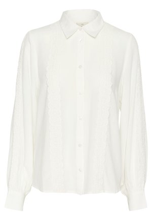 Vit långärmad blus med skjortkrage, med texturerade spetspaneler fram och rynkade manschetter. Mjuk tyg.